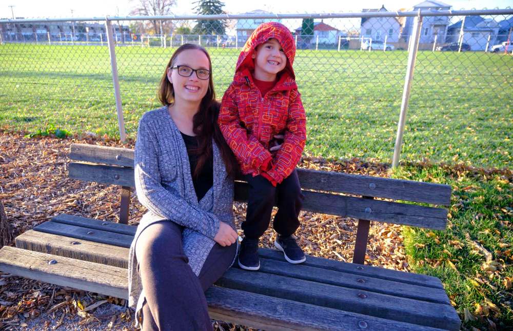 MIKE DEAL / WINNIPEG FREE PRESS
April Roller, with her son, Kyan Roller-Blacklaw, 6, a Grade 1 student at Weston School on the playground at Weston School.