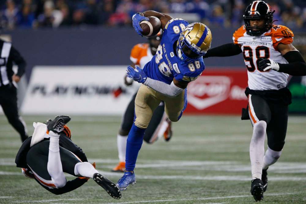 John Woods / The Canadian Press Files
Winnipeg Blue Bombers' Rasheed Bailey evades B.C. Lions' KiAnte Hardin in CFL action last month. Bailey is having his best pro season this year, despite challenges off the field.