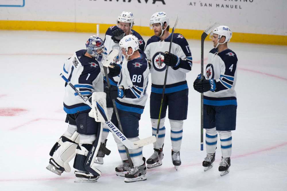 Kyusung Gong / The Associated Press
Winnipeg Jets celebrate a 3-2 win over the Los Angeles Kings in an NHL hockey game Thursday, Oct. 28, 2021, in Los Angeles.