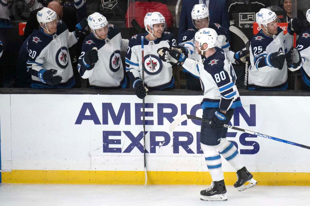 Kyusung Gong / The Associated Press
Winnipeg Jets center Pierre-Luc Dubois (80) is congratulated for his goal during the third period of the team's NHL hockey game against the Los Angeles Kings on Thursday, Oct. 28, 2021, in Los Angeles.