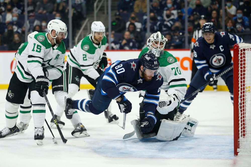 JOHN WOODS / WINNIPEG FREE PRESS
Winnipeg Jets’ Pierre-Luc Dubois takes flight as he scores against Dallas Stars goaltender Braden Holtby Tuesday night at Canada Life Centre.