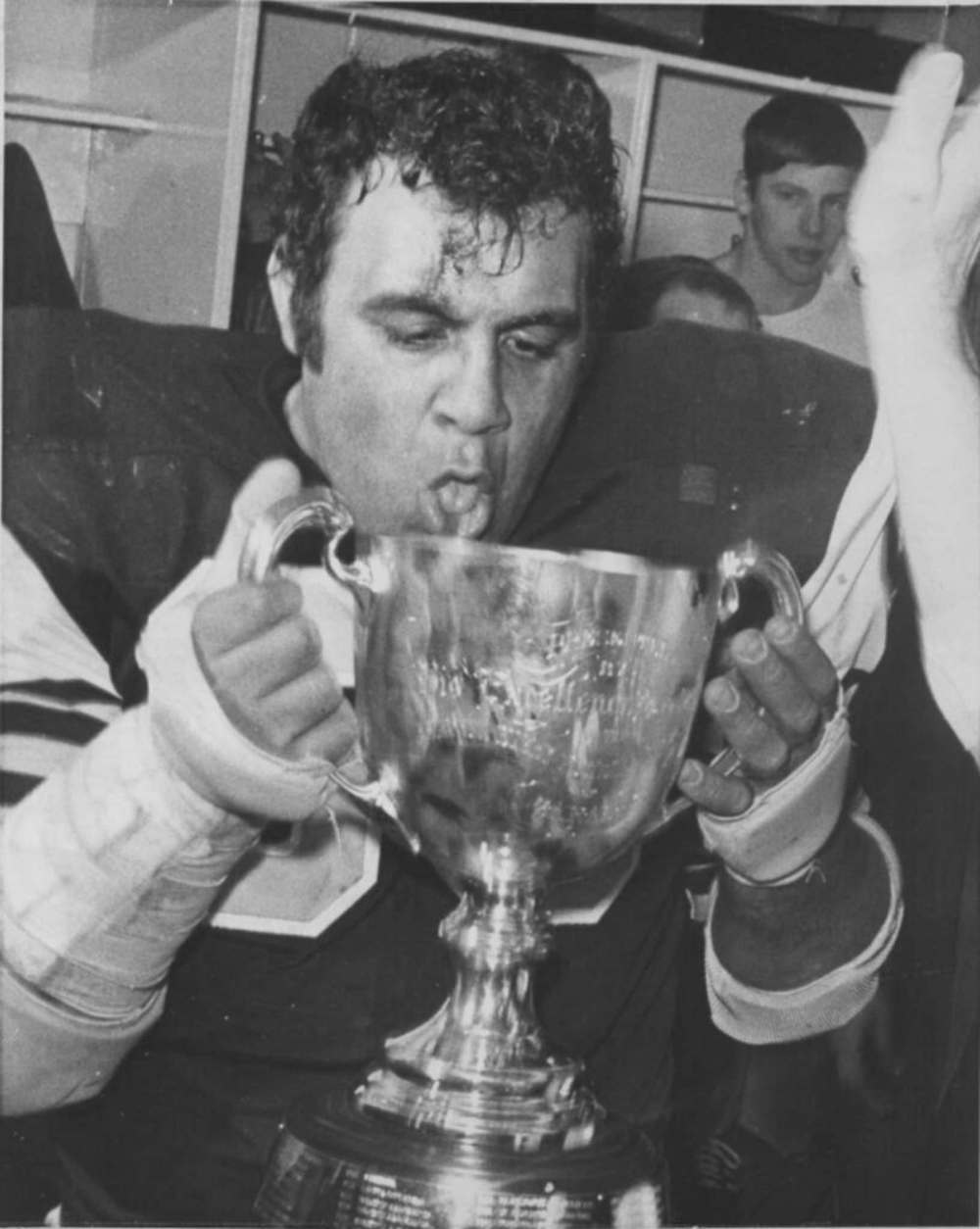 Hamilton Tiger-Cats' tackle Angelo Mosca drinks from the Grey Cup after beating Saskatchewan for the league title in 1972. THE CANADIAN PRESS/Chuck Stoody