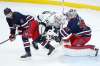 Winnipeg Jets goaltender Connor Hellebuyck (37) saves the shot as Neal Pionk (4) and Los Angeles Kings' Blake Lizotte (46) collide during third period NHL action in Winnipeg on Saturday, November 13, 2021. (John Woods / The Canadian Press files)