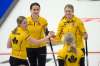 Skip Jacqueline Harrison of Dundas, Ont. top right, Lynn Kreviazuk, left, Laura Hickey, and Allison Flaxey celebrate after defeating Rachel Homan at the Tim Hortons Curling Trials in Saskatoon on Saturday. (Michael Burns / Curling Canada / The Canadian Press)