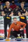 Michael Burns / Curling Canada
Brad Gushue eyes a shot in his match against Brad Jacobs (back, left) and Marc Kennedy.