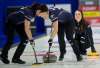Michael Burns / Curling Canada
Liz Fyfe (left) and Kristin MacCuish sweep for skip Tracy Fleury.