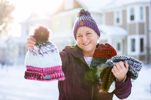 MIKAELA MACKENZIE / WINNIPEG FREE PRESS
Kyla Simms poses for a portrait with her toques in Winnipeg. She is an armed forces veteran who has made so many toques that she was able to give some to fellow patients and nurses at the health care facility in Ontario she was at and has recently donated 50 of them to Main Street Project.
