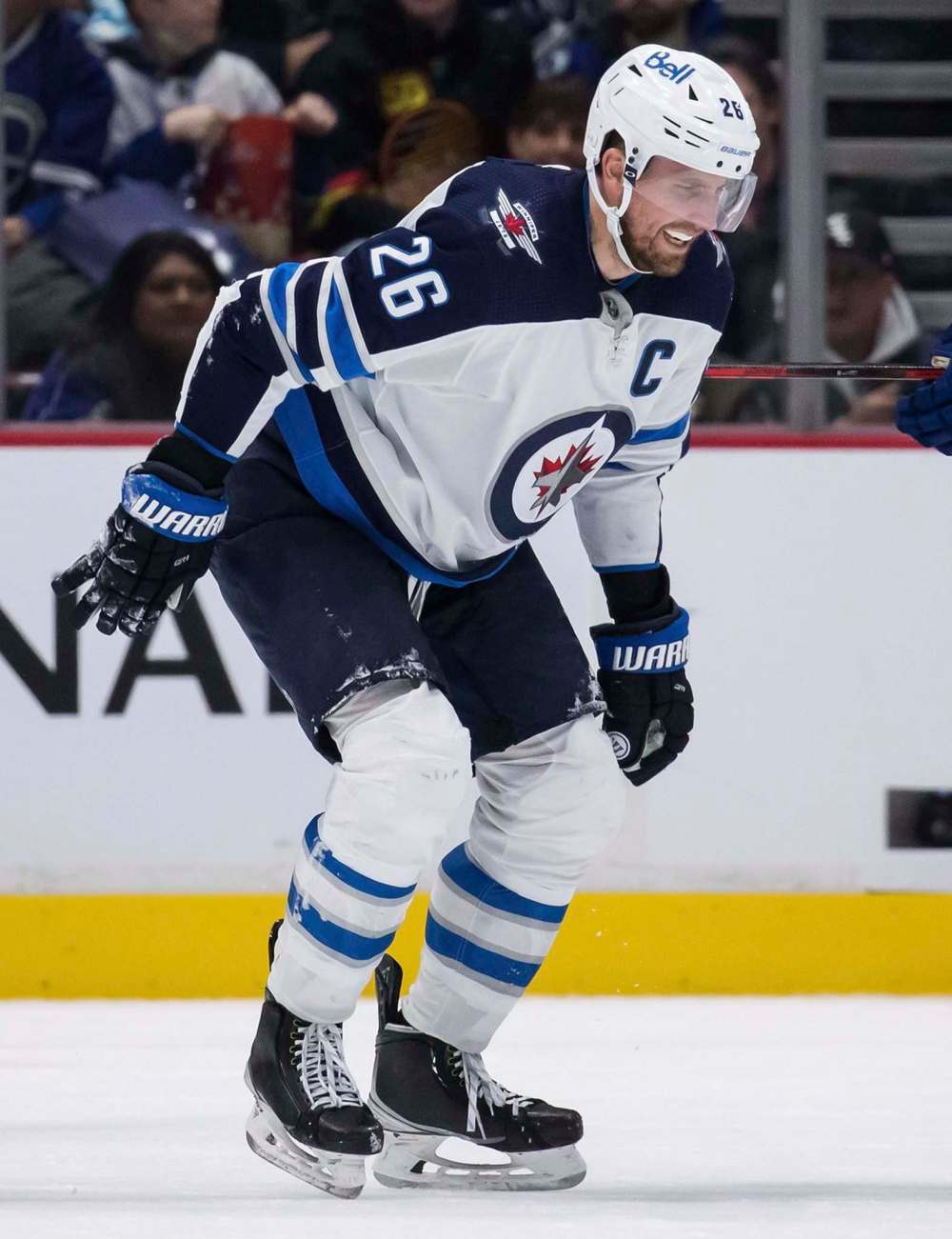 Darryl Dyck / The Canadian Press
Wheeler struggles to get to the bench after being injured during the third period. Wheeler left the game due to the injury and did not return to the ice.