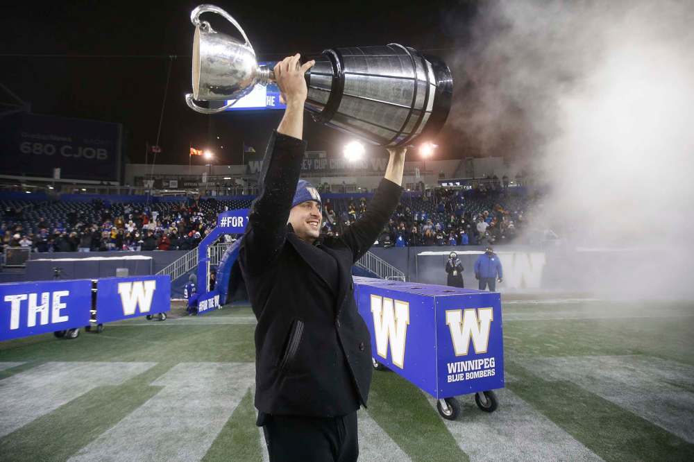 John Woods / The Canadian Press
Winnipeg Blue Bombers quarterback Zach Collaros hoists the Grey Cup during a victory celebration in Winnipeg on Wednesday.