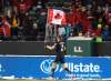 Canada's Alistair Johnston parades the flag to celebrate the win over Mexico during World Cup Qualifiers in Edmonton, in November. THE CANADIAN PRESS FILES/Jason Franson