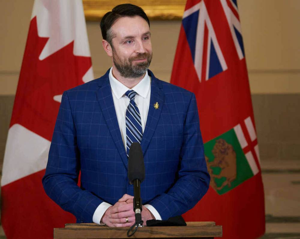 /DAVID LIPNOWSKI / THE CANADIAN PRESS 
Andrew Smith, Minister of Sport, Culture and Heritage, Minister Responsible for Manitoba Centennial Centre Corporation and Minister Responsible for Travel Manitoba, speaks to the media at a press conference after he is sworn-in at the Manitoba Legislative Building.