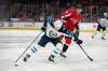 Patrick Semansky / The Associated Press
Jets left wing Nikolaj Ehlers (left) skates past Capitals defenceman Dmitry Orlov Tuesday in Washington. Orlov has been suspended two game for kneeing Ehlers later in the game.