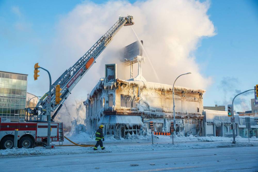 The fire in the Kirkwood Block, which started Wednesday morning, was still smouldering days later. The historic building, which was 110 years old, is a total loss and will be demolished. (Mike Deal / Winnipeg Free Press files)