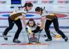 ANDREW VAUGHAN / THE CANADIAN PRESS
Manitoba skip Mackenzie Zacharias releases a rock as third Karlee Burgess (left) and second Emily Zacharias sweep during play at the Scotties Tournament of Hearts at Fort William Gardens in Thunder Bay, Ont.