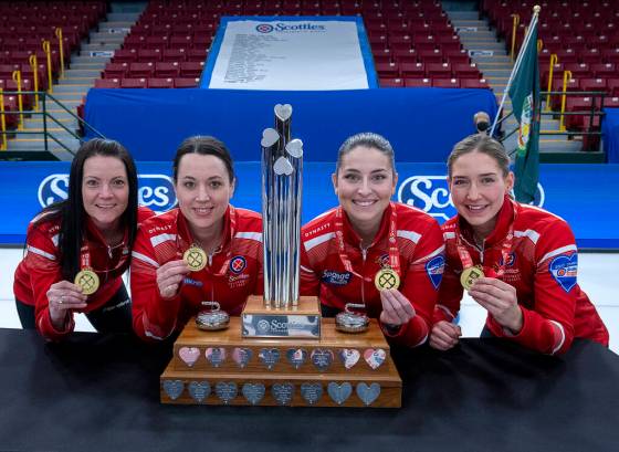 Team Canada skip Kerri Einarson, third Val Sweeting, second Shannon Birchard and lead Briane Meilleur (from left) pose with the trophy and medals after winning the Scotties Tournament of Hearts Sunday in Thunder Bay, Ont. (Andrew Vaughn / the Canadian Press)