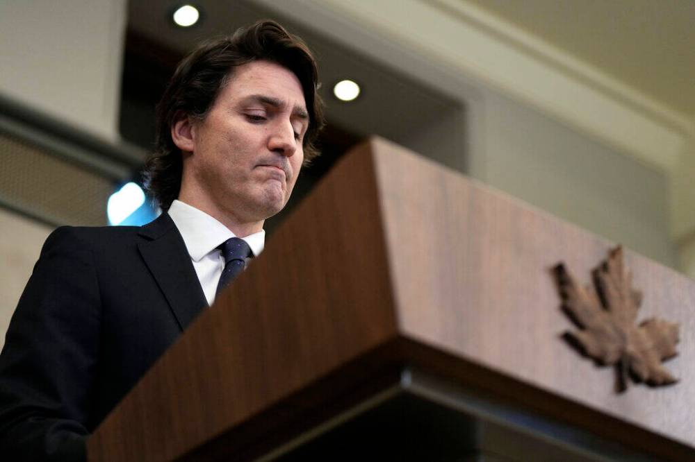Prime Minister Justin Trudeau speaks during a media availability about the ongoing protests in Ottawa and blockades at various Canada-U.S. borders, in West Block on Parliament Hill, in Ottawa on Friday, Feb. 11, 2022. On Monday, Feb. 14, 2022, as criticism of his hands-off approach mounted, Trudeau finally took forceful action against the truckers and other protesters who – angered by COVID-19 restrictions – have blockaded parts of Ottawa, the capital, for more than two weeks. (Justin Tang/The Canadian Press via AP)