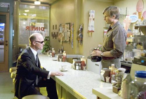 Tom Stall (Viggo Mortensen, right), runs a diner and lives a happy and quiet life until one day he attracts the attention of a mobster (Ed Harris) who believes he is someone else in A History of Violence. (Takashi Seida / New Line Cinema)