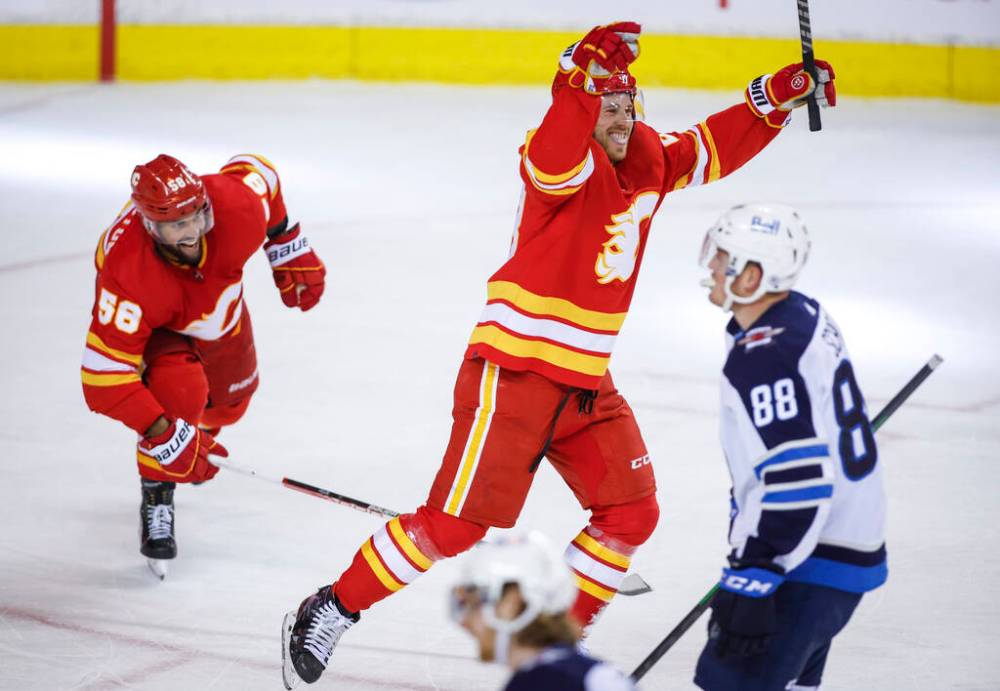 Elias Lindholm celebrates after scoring the game-winning goal with 47 seconds left in Monday's game. (Jeff McIntosh / The Canadian Press files)