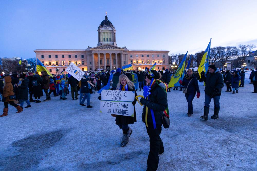 Many in the crowd, draped in flags and hoisting anti-war placards, proudly proclaimed their heritage, from first-generation to fourth-generation Ukrainian. (Daniel Crump / Winnipeg Free Press)