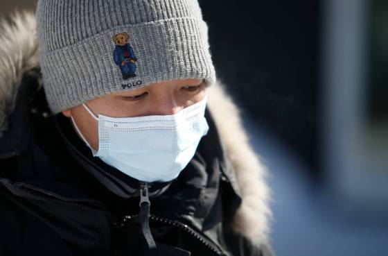 Thai Pham believes it's time for people to freely choose if they want to wear a mask or not. He plans to continue donning the mask. (John Woods / Winnipeg Free Press)