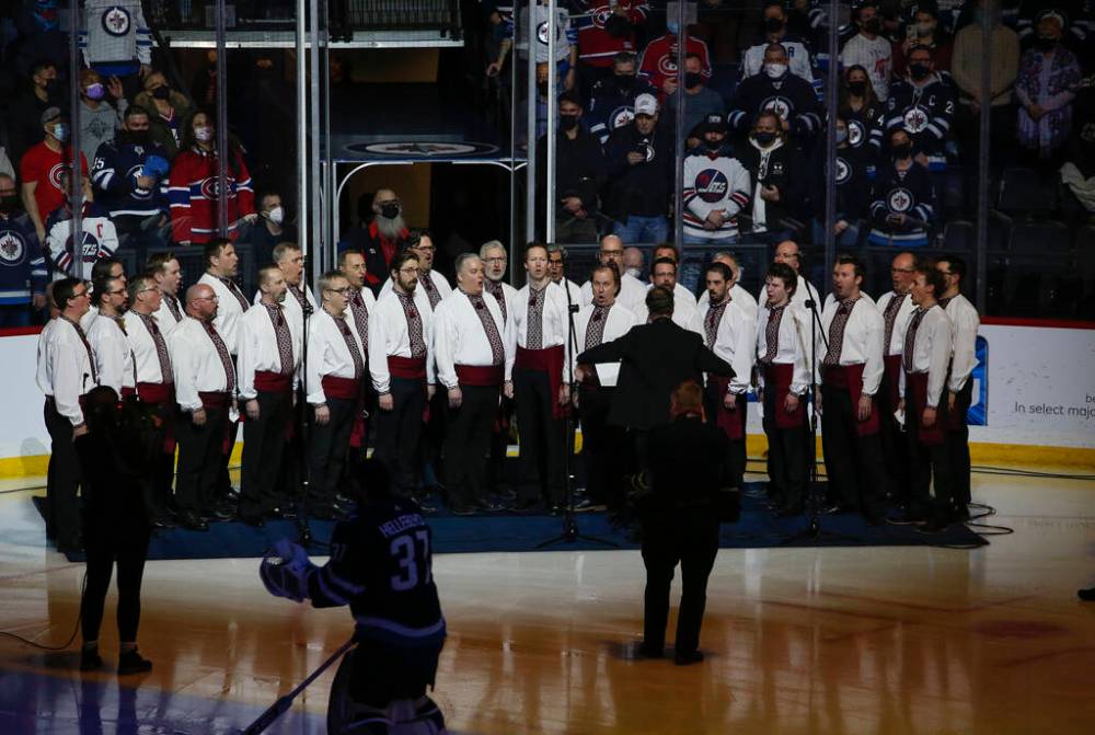 The Hoosli Male Chorus sing the Ukraine and Canada anthems before the Winnipeg Jets game on March 1. (John Woods / The Winnipeg Free Press files)