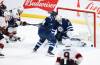 JOHN WOODS / THE CANADIAN PRESS
Ottawa Senators’ Colin White (36) scores the game-winning goal against Winnipeg Jets goaltender Connor Hellebuyck (37) as Josh Morrissey (44) defends during third-period NHL action in Winnipeg last week.