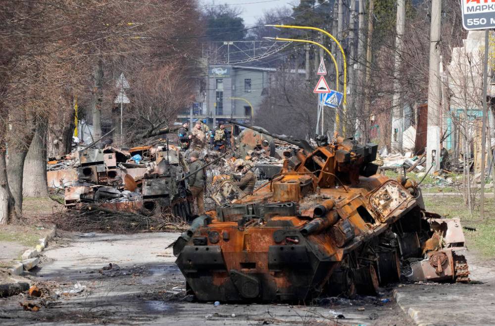 (AP Photo/Efrem Lukatsky)
Ukrainian soldiers examine destroyed Russian military vehicles following a battle in Bucha, Ukraine, on April 4.