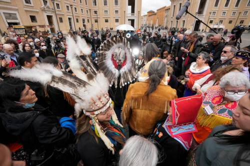 Members of a delegations by the Assembly of First Nations meet the journalists outside St. Peter’s Square at the end of a meeting with Pope Francis at the Vatican, Thursday. (Andrew Medichini / The Associated Press)