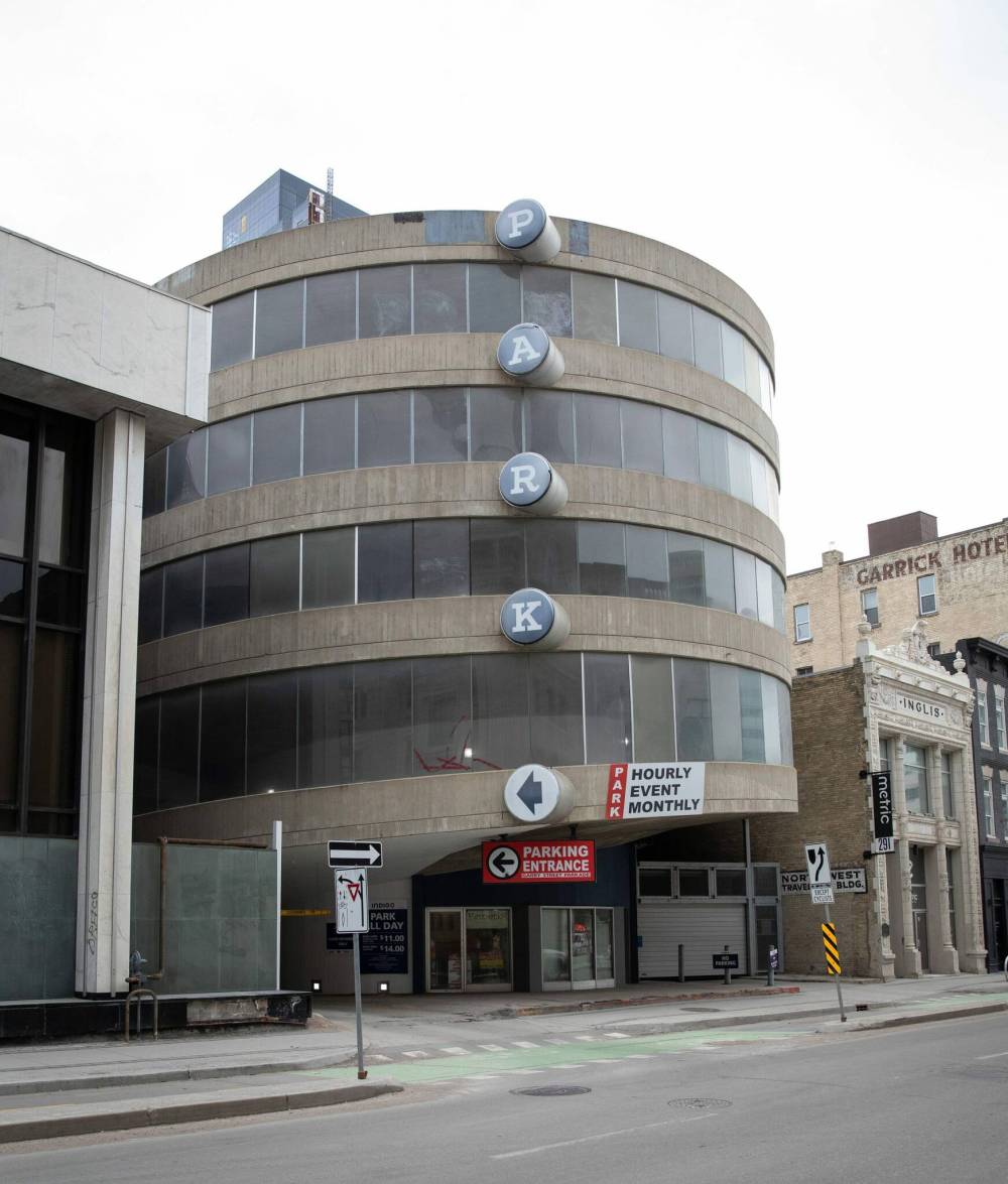 JESSICA LEE / WINNIPEG FREE PRESS
The parkade on Garry Street at Portage Avenue should be a model for future parking structures, disguised with street-level retail.
