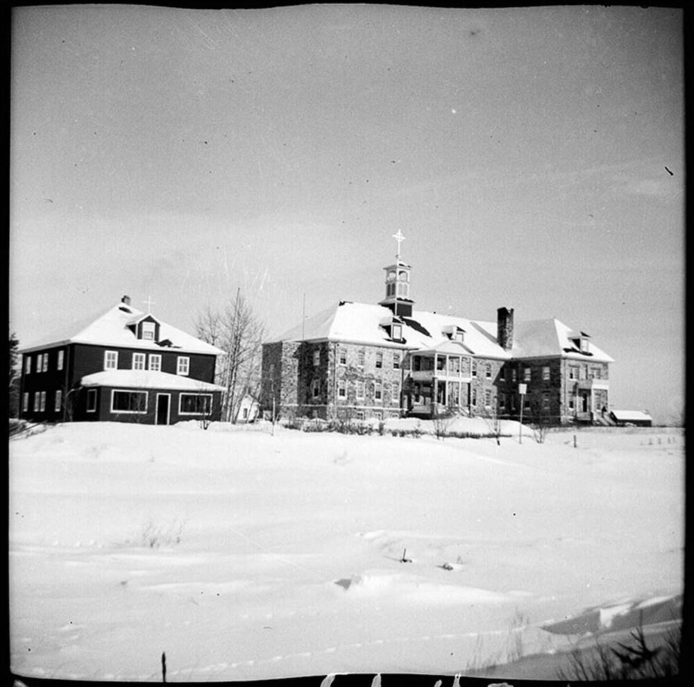 La Société historique de Saint-Boniface
Cross Lake residential school outbuildings and church in 1947.