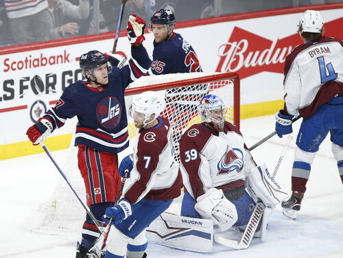 Winnipeg Jets’ Nikolaj Ehlers and Paul Stastny celebrate Ehlers’ goal on Colorado Avalanche goaltender Pavel Francouz during the first period. THE CANADIAN PRESS/John Woods
