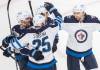 Winnipeg Jets’ Paul Stastny celebrates with teammates after scoring against the Montreal Canadiens during the second period in Montreal, Monday. THE CANADIAN PRESS/Graham Hughes