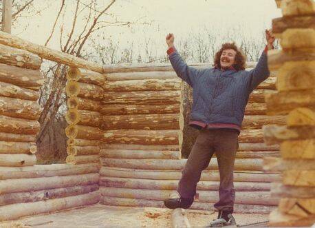 SuppliedDavid puts in the last log on a log home he and his wife built in the woods near Tyndall.