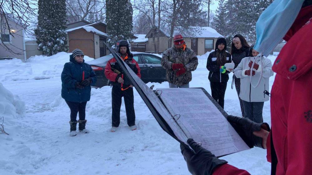 Kindra Stothers photo
Mourners gather at a candlelight vigil Sunday evening outside a Portage la Prairie duplex where the mother and her two children were killed. Their bodies were found after firefighters extinguished a blaze at the home on April 10.