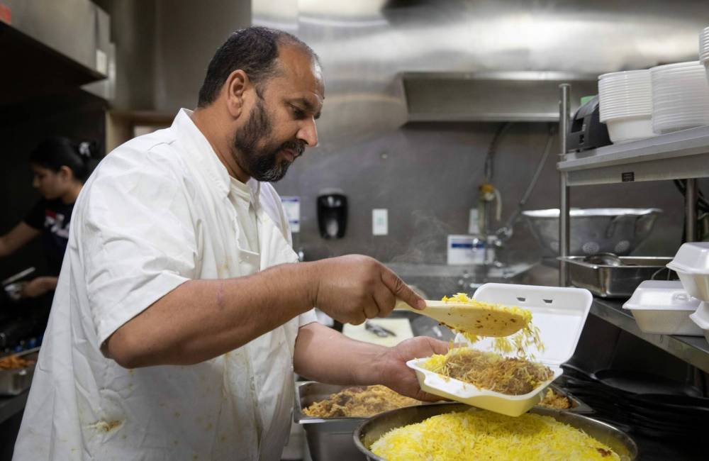 ‘My food tastes the same as what you’d get in Pakistan, I don’t modify it in any way, shape or form to make it less spicy for westerners,’ Jehangir Khan says, with a chuckle. (Jessica Lee / Winnipeg Free Press)