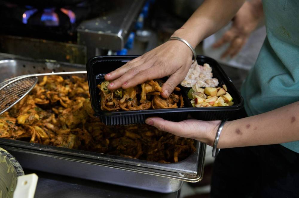 During COVID — and the owner’s travel-related two-year absence — Barbeque Hut-Pakistani Grill kept the doors open to do takeout and delivery of dishes like Iftar Special, which includes pakora and fruit salad. (Jessica Lee / Winnipeg Free Press)