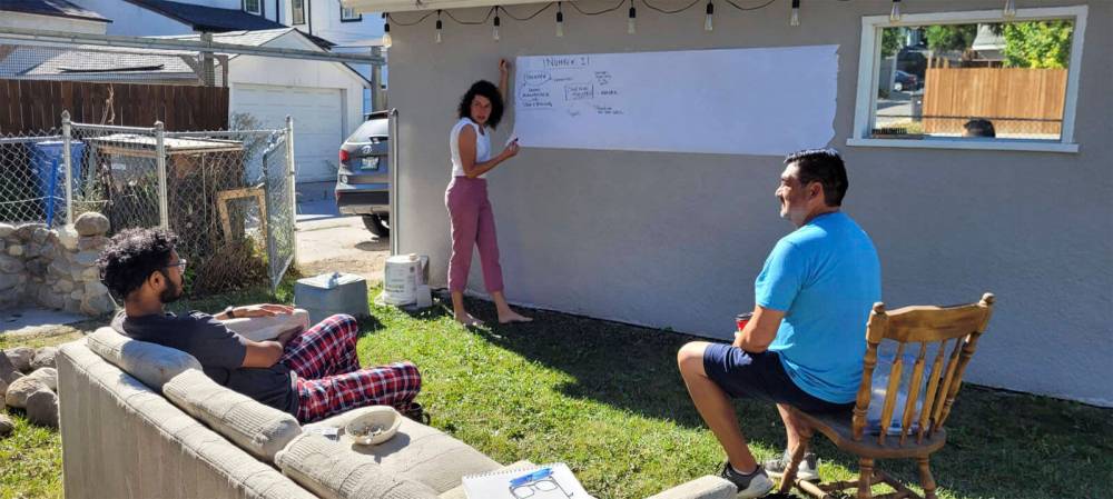 SUPPLIED
The End of the West Collective (from left, Nash, Jacquie Loewen and David Thomas) engage in backyard brainstorming.