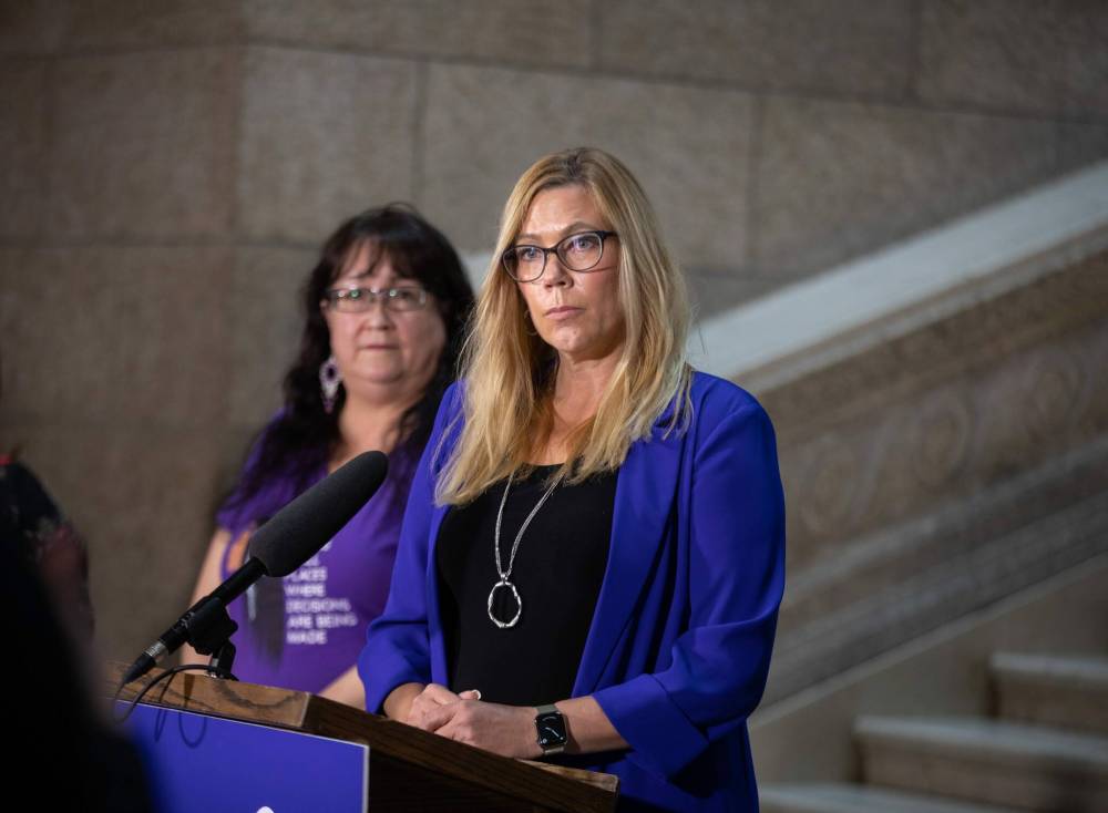 JESSICA LEE / WINNIPEG FREE PRESS
Families Minister Rochelle Squires (at podium) described the legislation as the “new generation” of Clare’s Law, a policy or statute used in other jurisdictions to ensure women and other vulnerable people are aware of an intimate partner’s history of violence or abuse.
