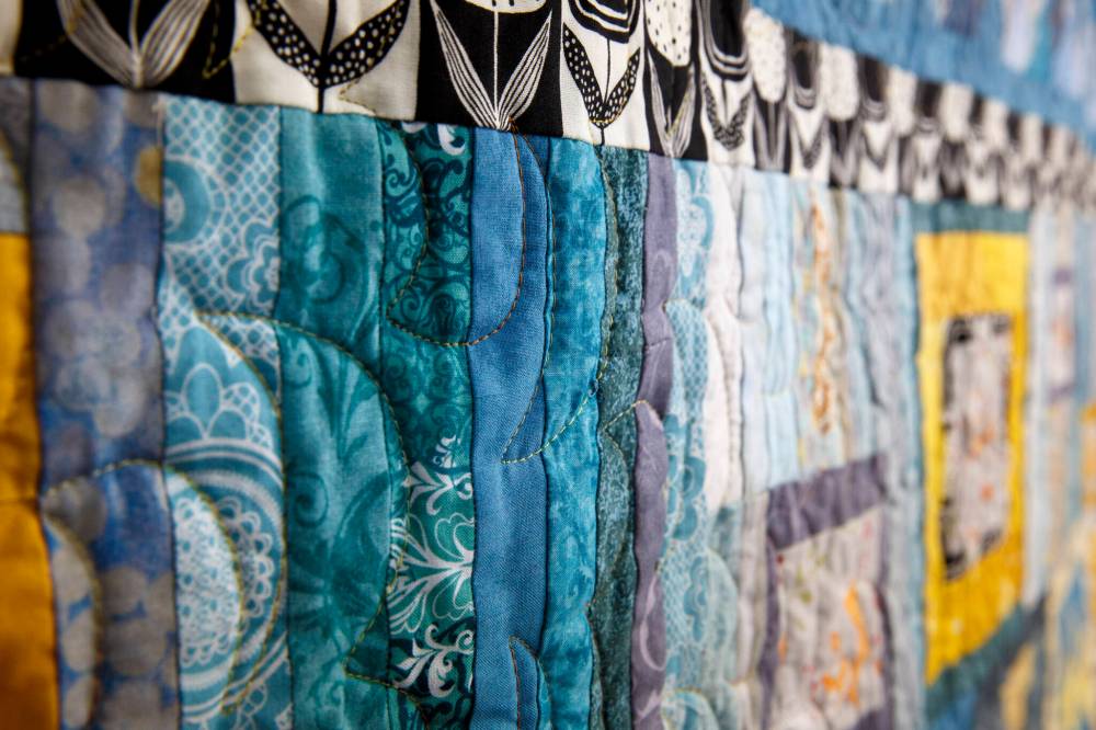 Receiving another box full of fabric and colours during dark winter days made it feel like Christmas for the avid seven-member quilting crew. (Mike Deal / Winnipeg Free Press)