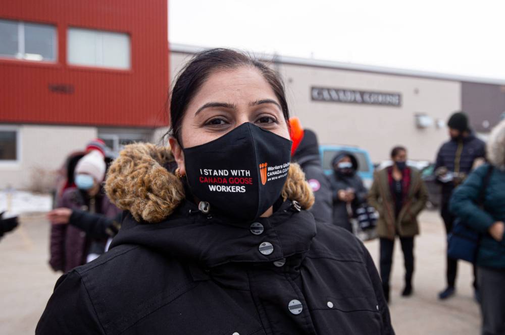 Mike Sudoma / Winnipeg Free Press Canada goose employee Kamlesh Jajuha wears a Workers United mask.