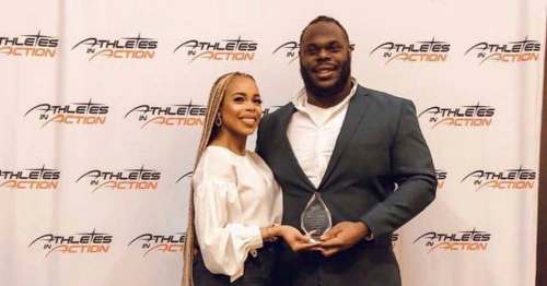 SUPPLIED
Drake Nevis, with wife Reese, gets his award at the Athletes In Action Grey Cup breakfast.