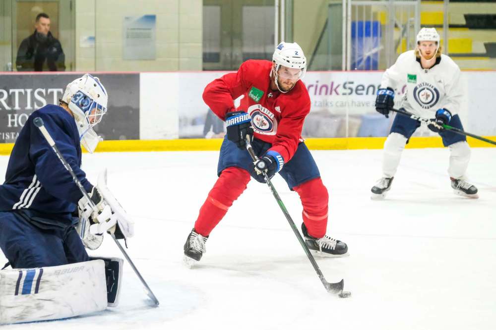 Daniel Crump / Winnipeg Free Press.
Anthony Bitetto controls the puck during Winnipeg Jets practice. The Jets are currentlly in a playoff position thanks, in part, to their strong play on the road in the month of November.