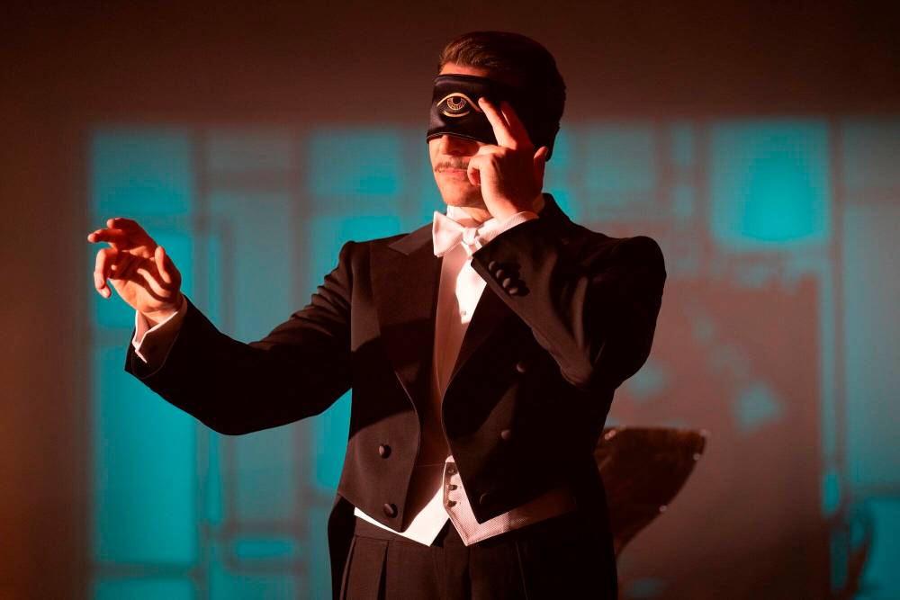 Kerry Hayes / Searchlight Pictures via AP
Nightmare Alley, set in the 1930s, focuses on a more-or-less amoral grifter (Bradley Cooper) who arrives at a low-rent carnival.