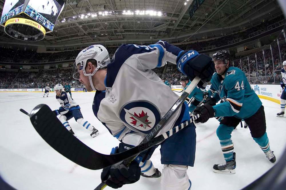 TONY AVELAR / THE ASSOCIATED PRESS FILES
Jets right-winger Logan Shaw (left) figures waiver-wire claim Nick Shore will bring a fresh look and a valuable veteran presence to the team’s fourth line.