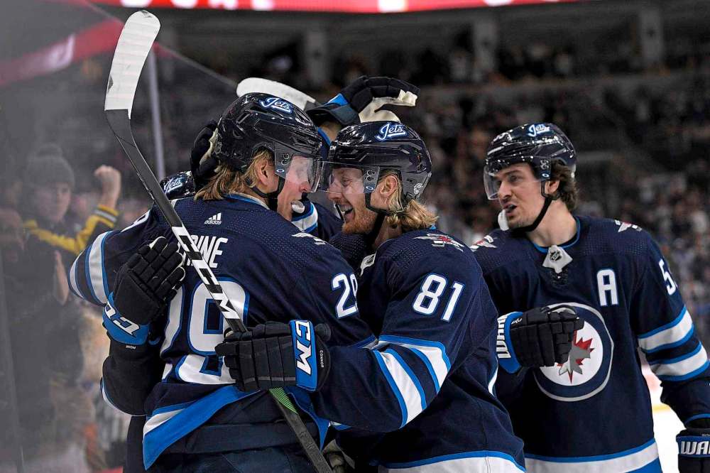 THE CANADIAN PRESS/Fred Greenslade
Winnipeg Jets' Patrik Laine celebrates his goal against the Detroit Red Wings with his linemates during second period action on Tuesday.