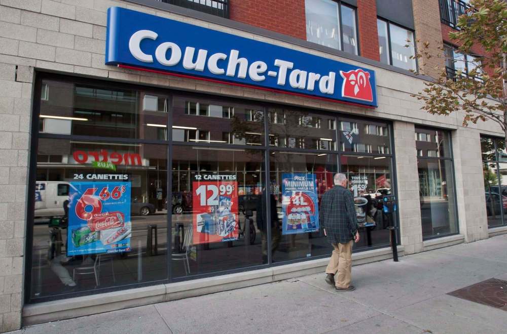 Graham Hughes / The Canadian Press Files
A man passes by a Couche-Tard convenience store in Montreal. Quebec convenience store giant Alimentation Couche-Tard aims to double net earnings in the next five years.