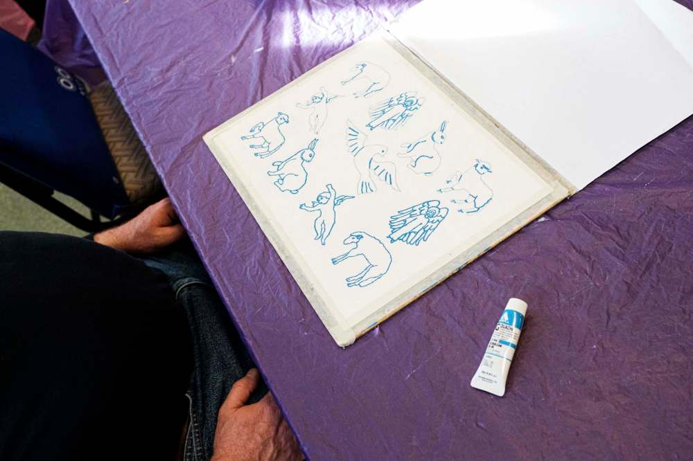McCracken shows off some of his sketches.