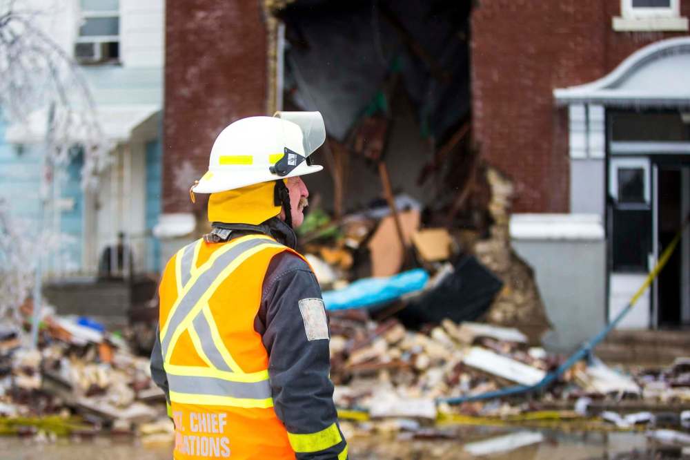 Winnipeg Fire Paramedic Service Ihor Holowczynsky at the scene of an apartment fire on Agnes Street on Boxing Day. (Mikaela MacKenzie / Winnipeg Free Press)