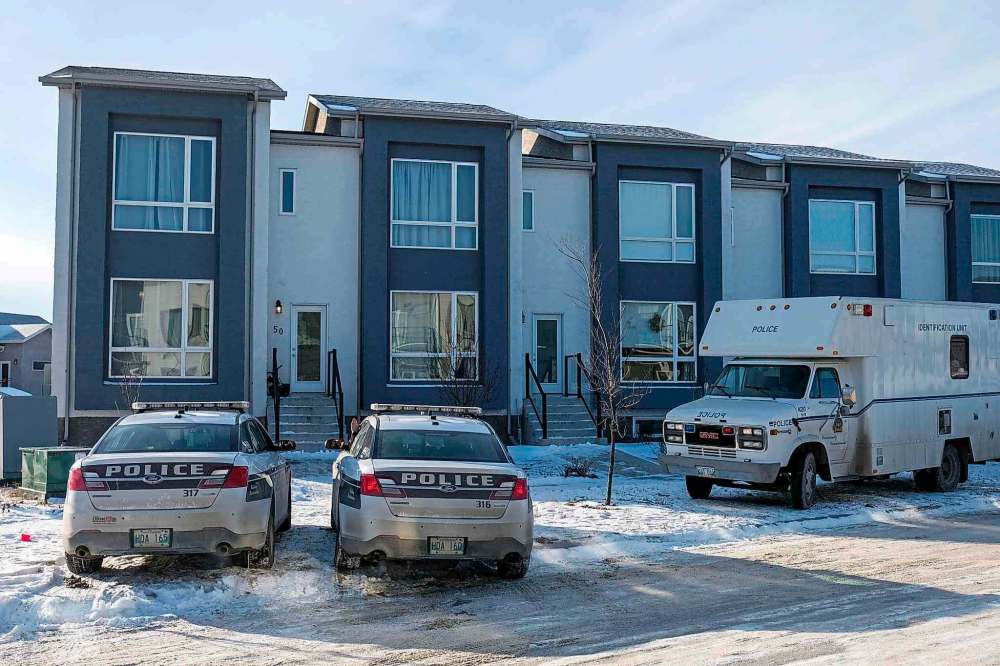 Winnipeg Police were on scene Saturday investigating what they are calling a “serious incident” at a house on Highwater Path in the Inkster Gardens neighbourhood. (Daniel Crump / Winnipeg Free Press)