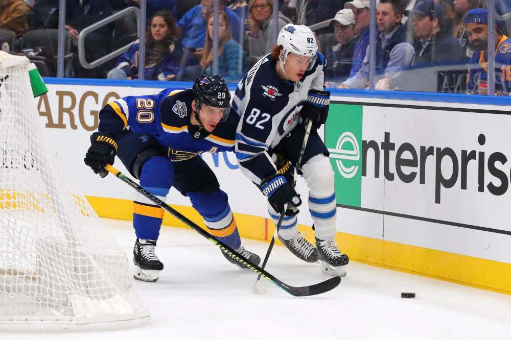 St. Louis Blues winger Alexander Steen (20) defends against Winnipeg Jets centre Mason Appleton (82) during the first period of an NHL hockey game Sunday in St. Louis. (Dilip Vishwanat / The Associated Press)
